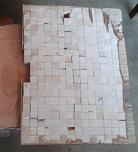 One of the wooden boards inlaid with cubes of ivory